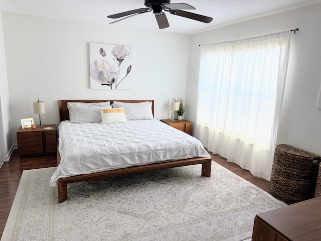 bedroom featuring a ceiling fan and wood finished floors