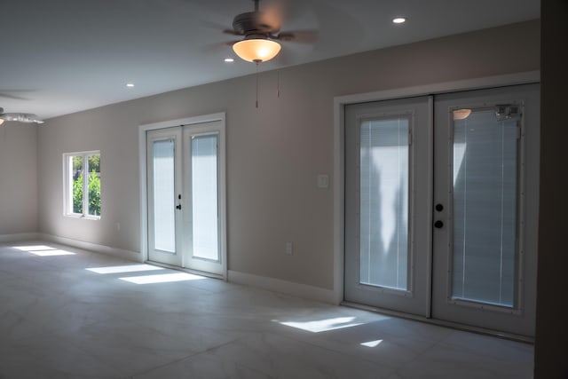 spare room featuring recessed lighting, baseboards, ceiling fan, and french doors