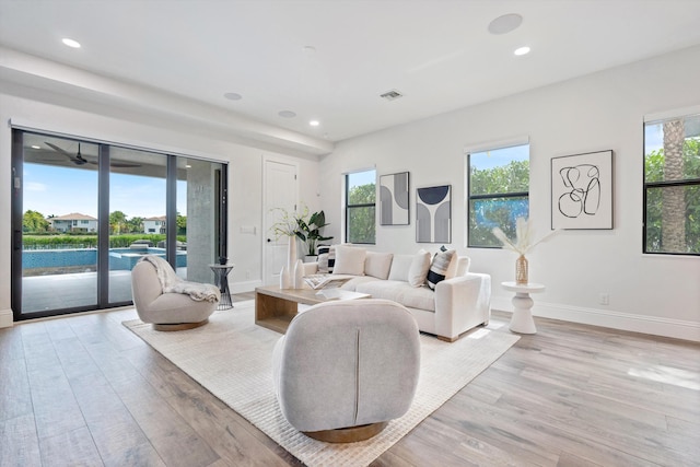 10343 S Barnsley Dr, Parkland, FL 33076 - living room with healthy amount of natural light, light wood-style flooring, and recessed lighting