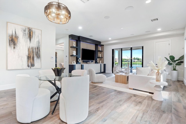 10343 S Barnsley Dr, Parkland, FL 33076 - dining area with light wood-type flooring, recessed lighting, and a chandelier