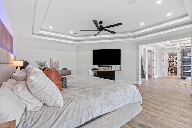 10343 S Barnsley Dr, Parkland, FL 33076 - bedroom featuring a raised ceiling, light wood-type flooring, recessed lighting, and a ceiling fan
