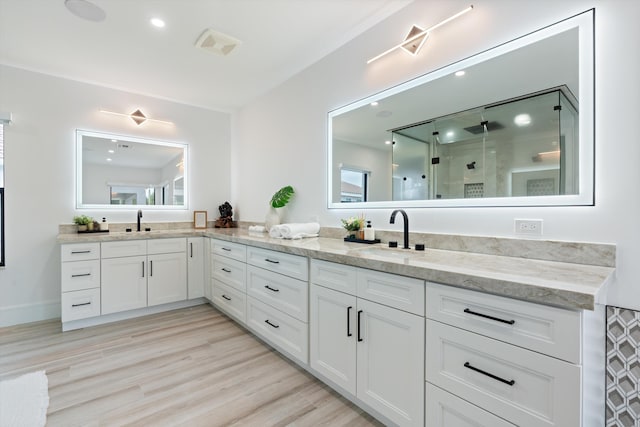 10343 S Barnsley Dr, Parkland, FL 33076 - full bath featuring double vanity, a stall shower, wood finished floors, and recessed lighting