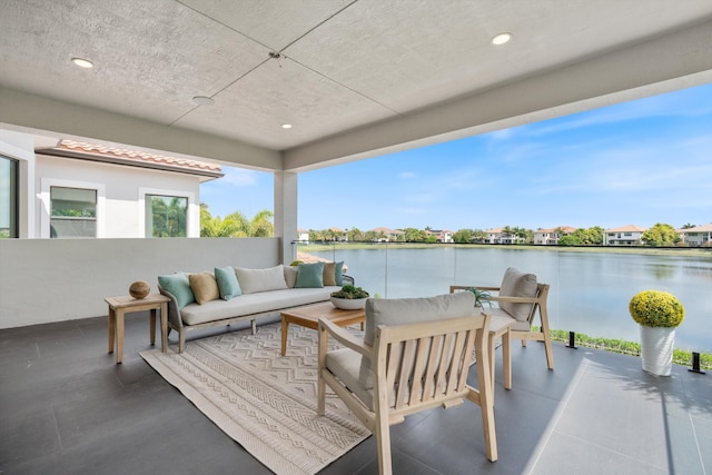 10343 S Barnsley Dr, Parkland, FL 33076 - view of patio with a water view and an outdoor living space