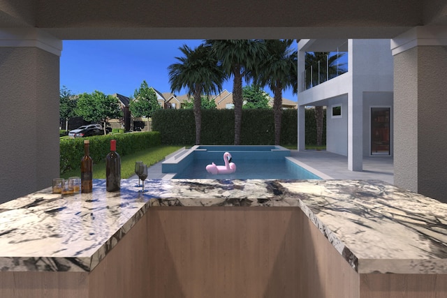 view of swimming pool with a jacuzzi and a patio area