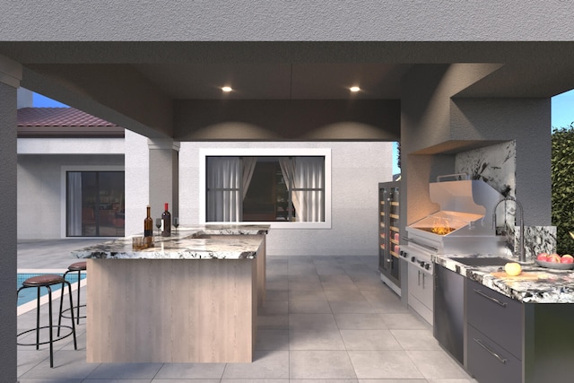 view of patio / terrace featuring an outdoor kitchen