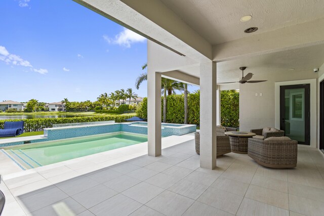10343 S Barnsley Dr, Parkland, FL 33076 - view of patio with an in-ground hot tub, an outdoor pool, and ceiling fan