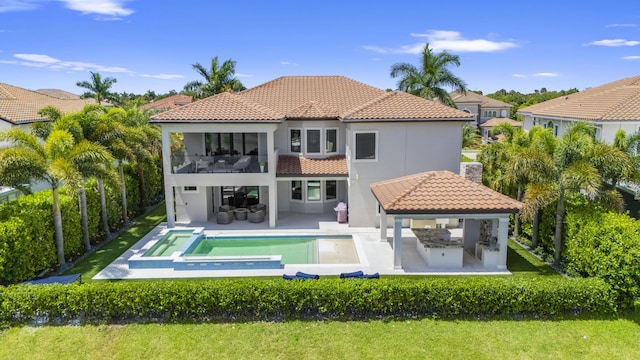 10343 S Barnsley Dr, Parkland, FL 33076 - back of property featuring a gazebo, a balcony, an outdoor kitchen, outdoor lounge area, and a tiled roof