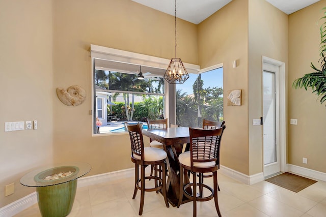 dining room featuring baseboards and tile patterned floors