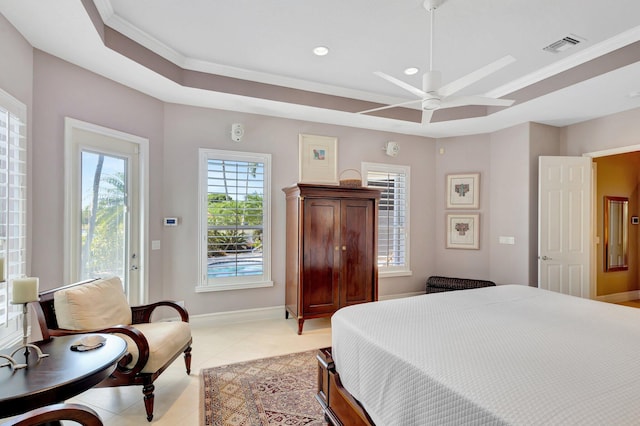 bedroom featuring visible vents, ornamental molding, baseboards, a raised ceiling, and light tile patterned floors