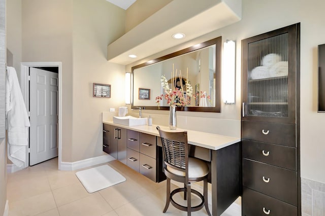 bathroom with vanity, tile patterned flooring, baseboards, and recessed lighting