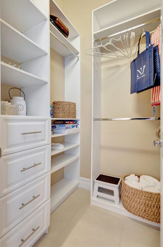 walk in closet featuring light tile patterned floors