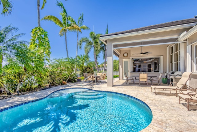 view of pool featuring a fenced in pool, ceiling fan, and a patio area