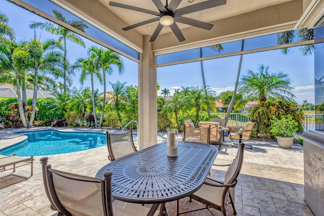 view of pool featuring outdoor dining space, ceiling fan, a fenced in pool, a fenced backyard, and a patio area