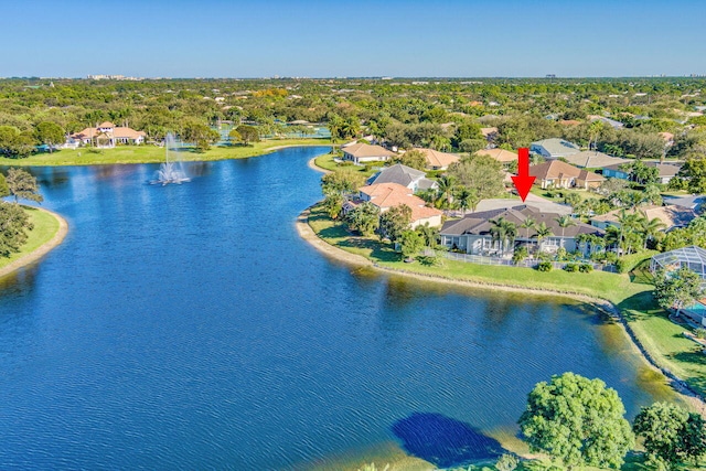 birds eye view of property with a water view and a residential view