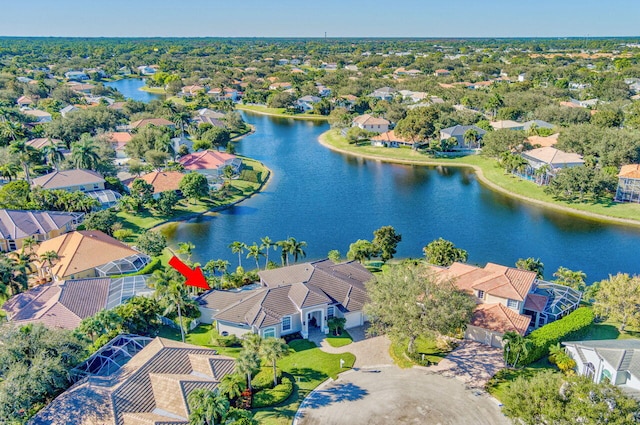 drone / aerial view with a residential view and a water view