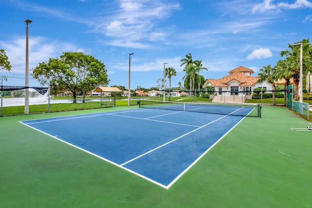 view of sport court featuring community basketball court and fence