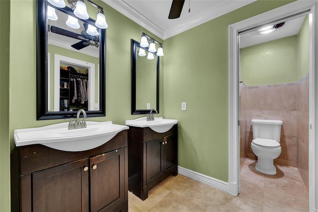 4160 Juniper Ter, Boynton Beach, FL 33436 - bathroom with two vanities, crown molding, baseboards, and a sink