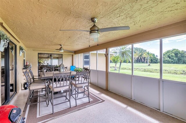 4160 Juniper Ter, Boynton Beach, FL 33436 - sunroom featuring a healthy amount of sunlight, a ceiling fan, and outdoor dining space