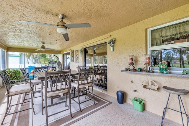 4160 Juniper Ter, Boynton Beach, FL 33436 - sunroom with a bar, outdoor dining area, and ceiling fan