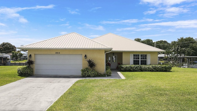 ranch-style house featuring an attached garage, concrete driveway, a front yard, and stucco siding