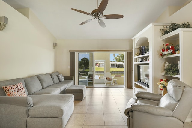 living room featuring vaulted ceiling, built in features, ceiling fan, and light tile patterned flooring