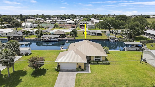 drone / aerial view featuring a residential view and a water view