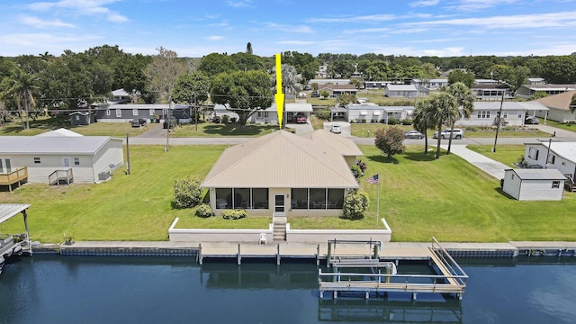 birds eye view of property featuring a residential view and a water view