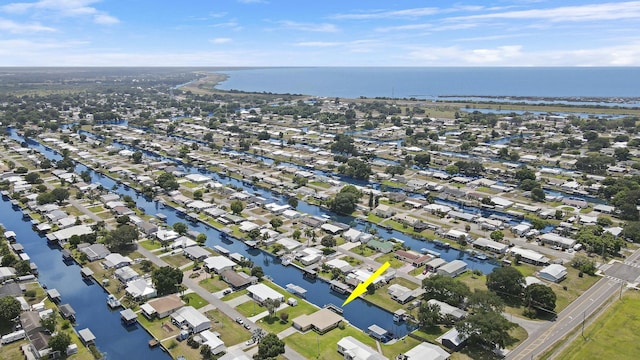 drone / aerial view featuring a residential view and a water view