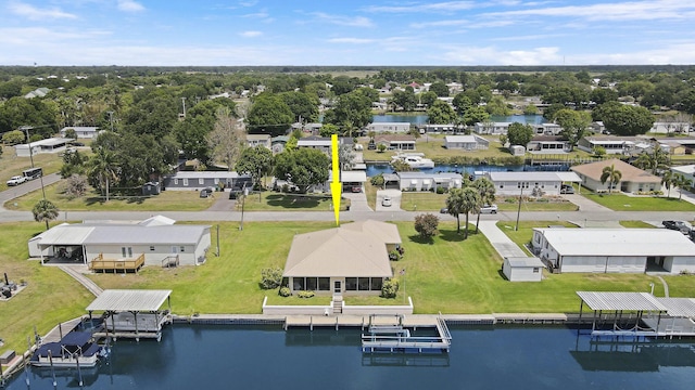 drone / aerial view with a water view and a residential view
