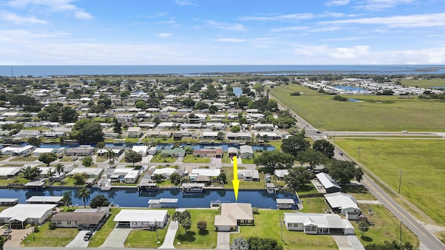 drone / aerial view with a residential view and a water view