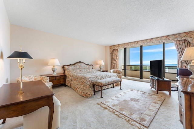 100 Lakeshore Dr Unit 1557, North Palm Beach, FL 33408 - bedroom featuring a textured ceiling and carpet flooring
