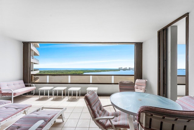 100 Lakeshore Dr Unit 1557, North Palm Beach, FL 33408 - living area with a water view and tile patterned flooring