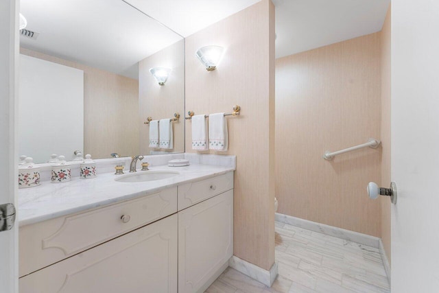 100 Lakeshore Dr Unit 1557, North Palm Beach, FL 33408 - bathroom with marble finish floor, visible vents, vanity, and baseboards