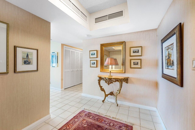 100 Lakeshore Dr Unit 1557, North Palm Beach, FL 33408 - hallway with baseboards, visible vents, and light tile patterned flooring