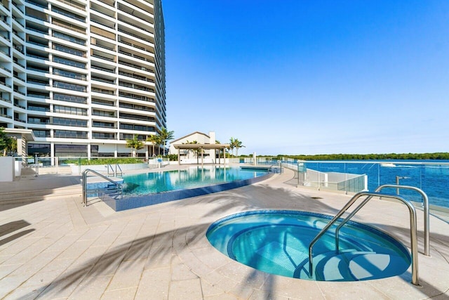 100 Lakeshore Dr Unit 1557, North Palm Beach, FL 33408 - community pool with a patio and a hot tub