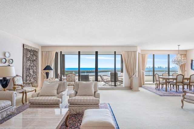 100 Lakeshore Dr Unit 1557, North Palm Beach, FL 33408 - carpeted living area featuring an inviting chandelier, a textured ceiling, and a water view
