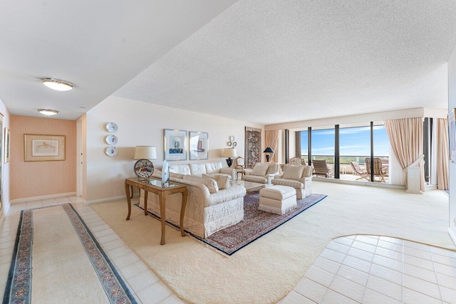 100 Lakeshore Dr Unit 1557, North Palm Beach, FL 33408 - tiled living area featuring a textured ceiling, carpet flooring, and baseboards