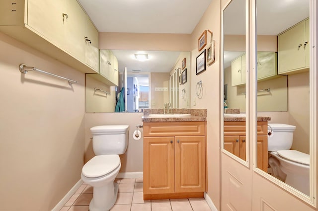 3718 Victoria Dr, West Palm Beach, FL 33406 - bathroom with toilet, tile patterned floors, vanity, and baseboards