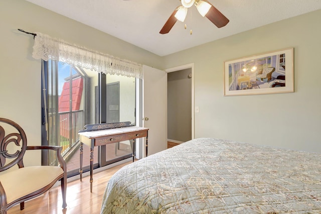 3718 Victoria Dr, West Palm Beach, FL 33406 - bedroom featuring multiple windows, wood finished floors, and a ceiling fan