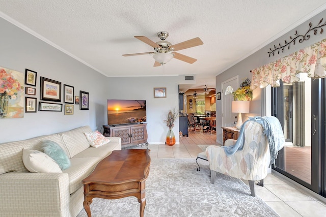 3718 Victoria Dr, West Palm Beach, FL 33406 - living room with light tile patterned floors, a ceiling fan, crown molding, and a textured ceiling