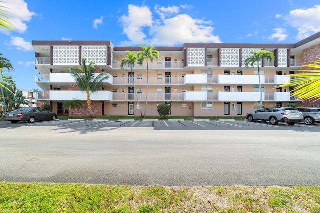 view of property featuring uncovered parking