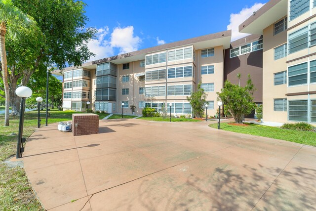 2951 NW 46th Ave Unit 306, Lauderdale Lakes, FL 33313 - view of apartment building / complex