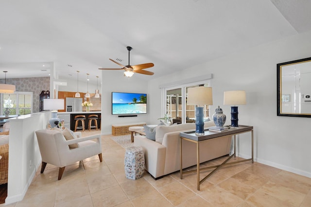 620 NE 15th Pl, Boynton Beach, FL 33435 - living area with vaulted ceiling, a ceiling fan, baseboards, and light tile patterned flooring