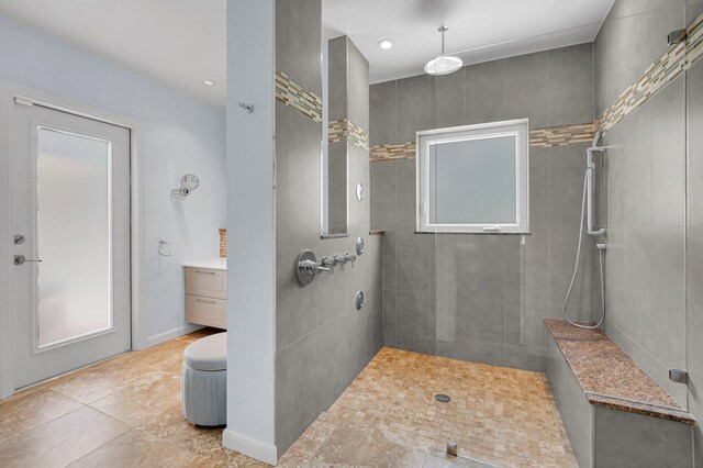 620 NE 15th Pl, Boynton Beach, FL 33435 - full bath featuring tiled shower, tile patterned flooring, and vanity