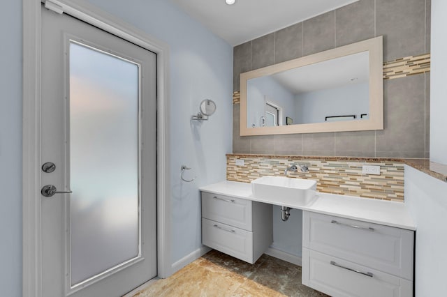 620 NE 15th Pl, Boynton Beach, FL 33435 - bathroom featuring tasteful backsplash, vanity, and baseboards