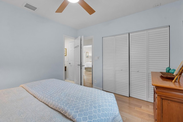 620 NE 15th Pl, Boynton Beach, FL 33435 - bedroom with light wood-style floors, a closet, and a ceiling fan