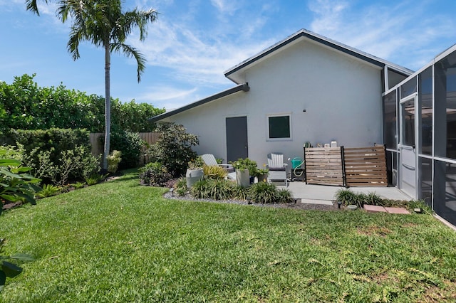 620 NE 15th Pl, Boynton Beach, FL 33435 - view of yard with glass enclosure and a patio area