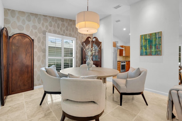 620 NE 15th Pl, Boynton Beach, FL 33435 - dining space featuring wallpapered walls and baseboards