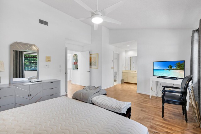 7940 La Mirada Dr, Boca Raton, FL 33433 - bedroom featuring light wood finished floors, baseboards, high vaulted ceiling, ensuite bathroom, and ceiling fan