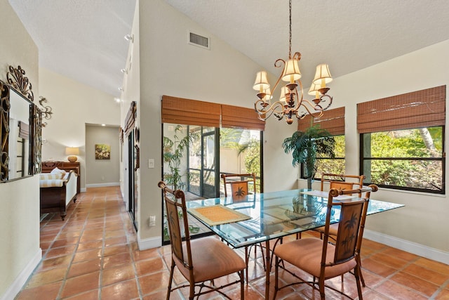 dining space with high vaulted ceiling, plenty of natural light, and baseboards